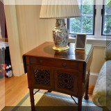F04. Double drop leaf side table with fretwork sides and doors. 30”h x 26”w x 23”d 